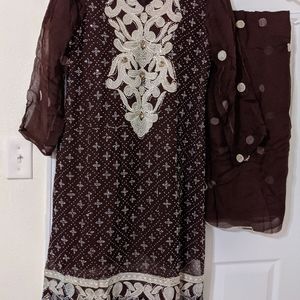 Pakistani dress in brown color.